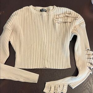 Cream Ribbed Sweater with skirt. Cutout Details